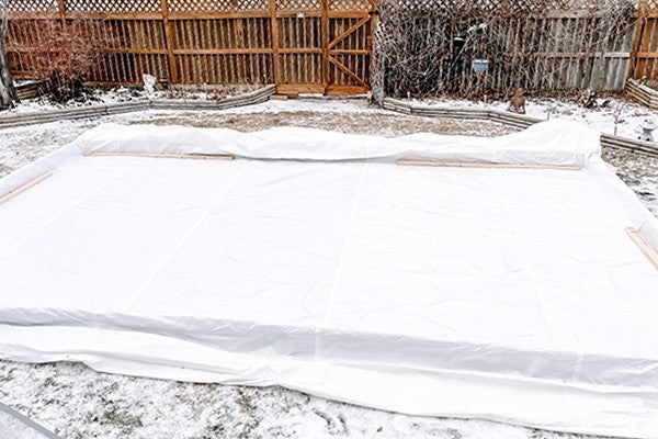Step 3 Line your Backyard Skating Rink with a Tarp - Munro Industries
